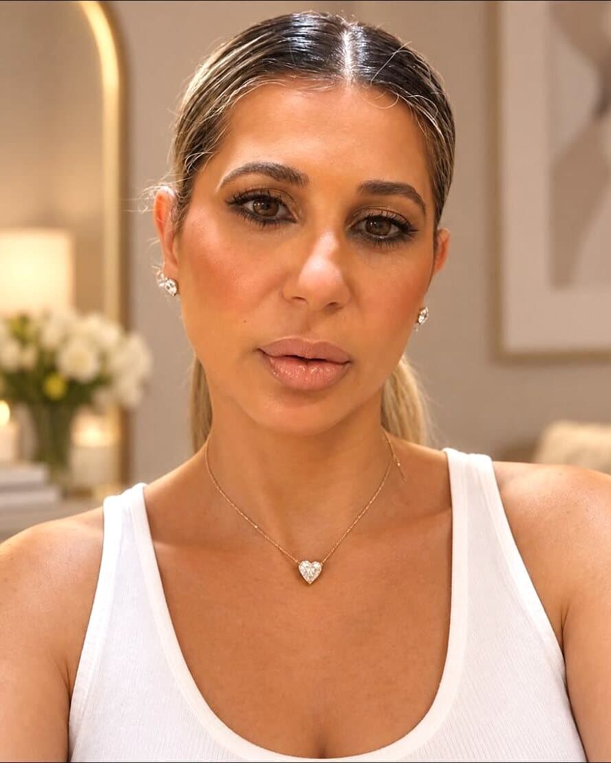 Rosie standing in her Midwood spray tan studio
